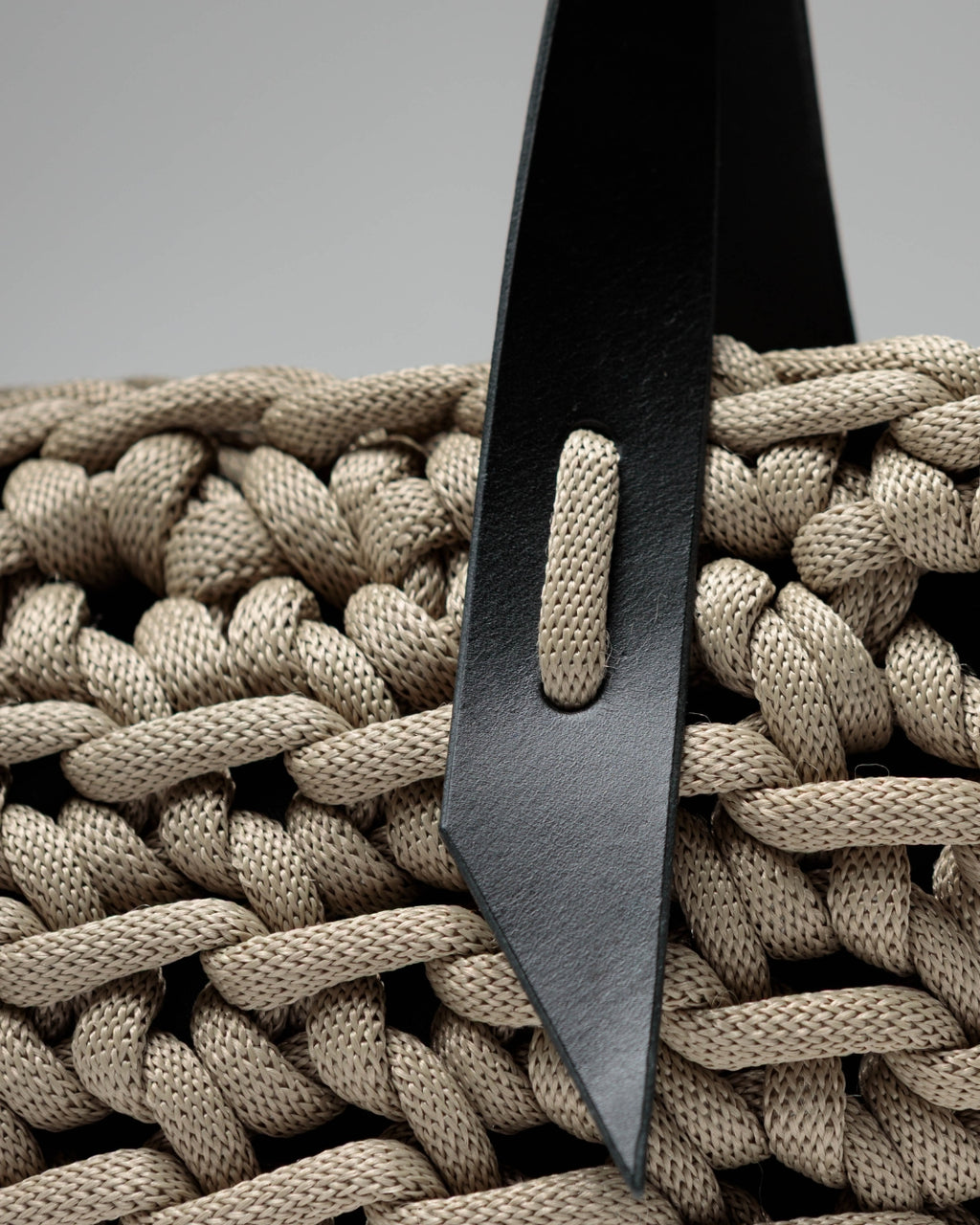 Handmade taupe nautical rope bag, crafted by hand in Portugal using lightweight rope, photographed in natural light.